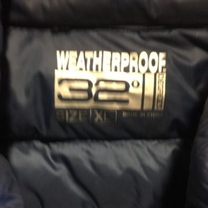 Two nylon quilted vests with pockets & zippers